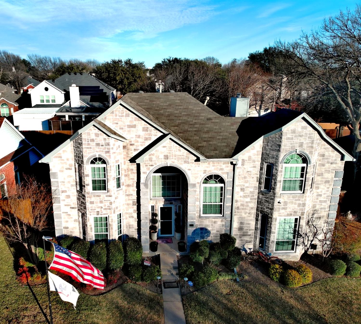 Drone inspection: front elevation and roof planes from above