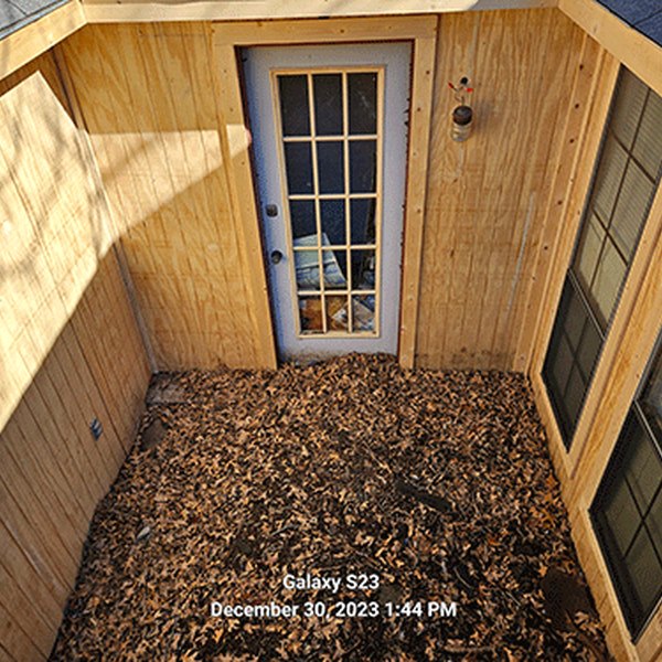 After: the same alcove rebuilt in new cedar siding