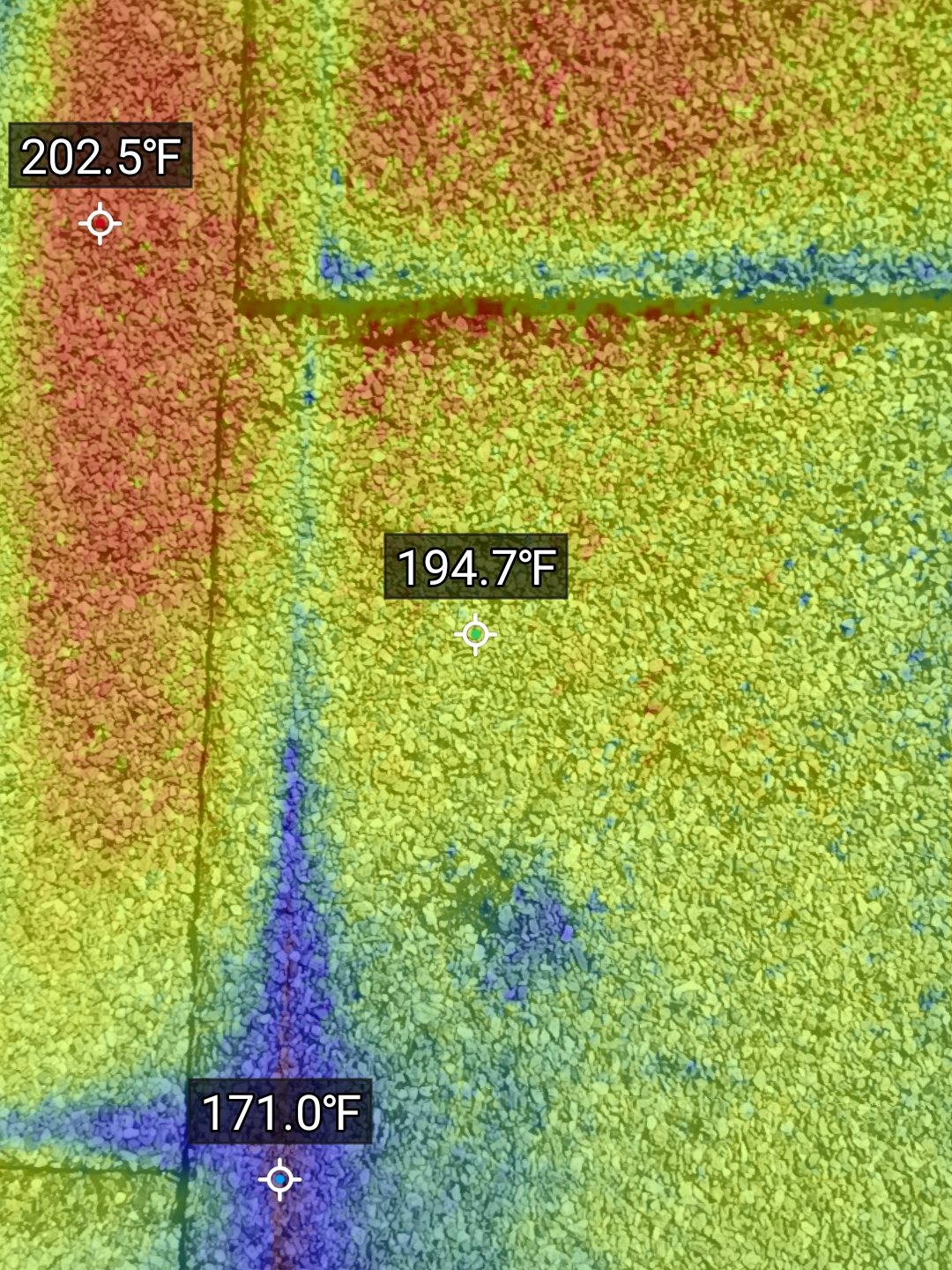Thermal overlay on shingles showing cool streaks where moisture travels beneath the surface